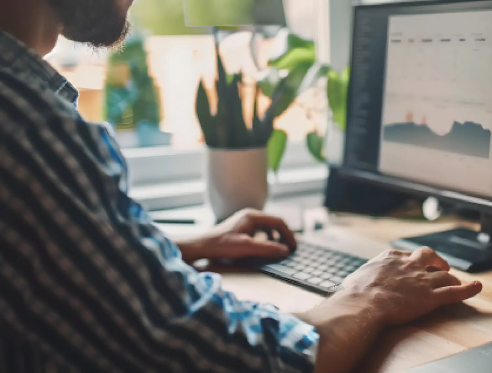 Man actively using desktop computer
